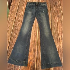 Grace Trouser Flare. Grace in LA Size 27. Distressed. Hems are not ripped.